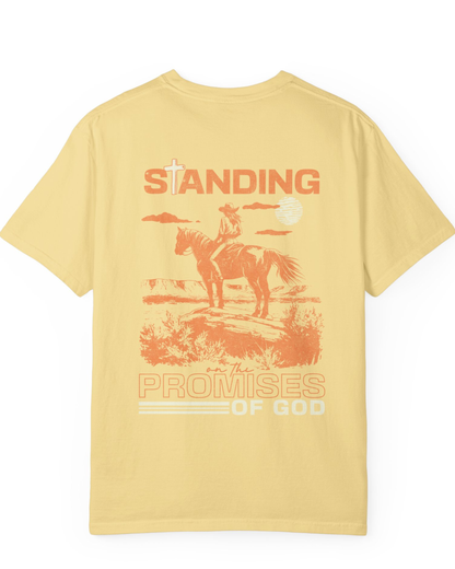 Yellow faith based western t-shirt with “Standing on the Promises of God” design, flat lay product image